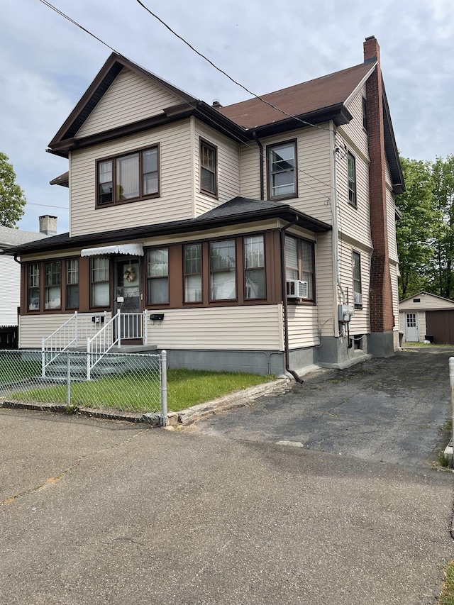339 Washington Ave, West Haven, CT 06516 - view of front of house with a fenced front yard and a chimney