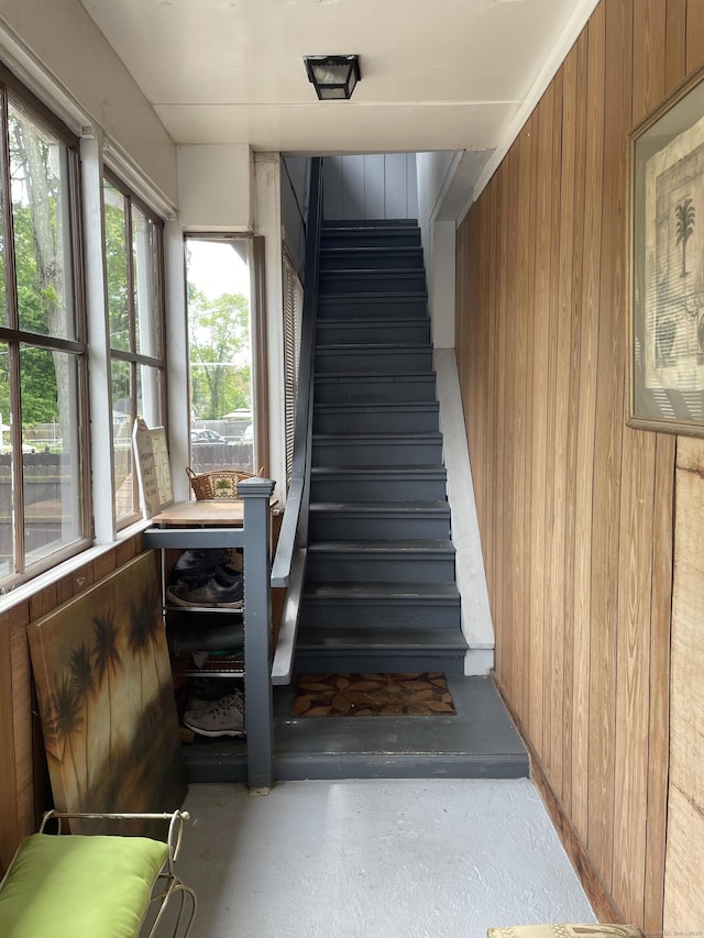 339 Washington Ave, West Haven, CT 06516 - stairs featuring wooden walls and concrete flooring
