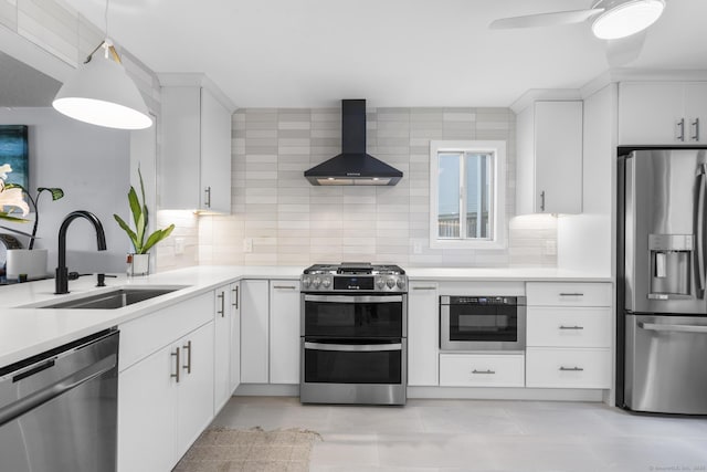 2 Mansfield Grove Rd Apt 166, East Haven, CT 06512 - kitchen with appliances with stainless steel finishes, wall chimney range hood, a sink, backsplash, and light countertops