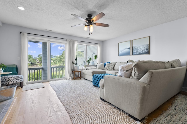 2 Mansfield Grove Rd Apt 166, East Haven, CT 06512 - living area featuring wood finished floors, ceiling fan, and a textured ceiling