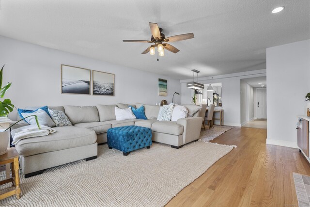 2 Mansfield Grove Rd Apt 166, East Haven, CT 06512 - living room with ceiling fan, wood finished floors, baseboards, a textured ceiling, and recessed lighting