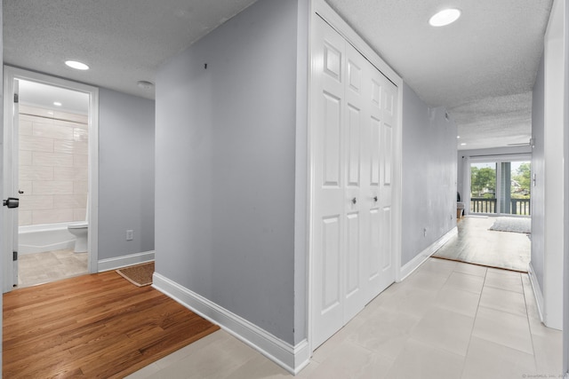2 Mansfield Grove Rd Apt 166, East Haven, CT 06512 - hall with a textured ceiling, baseboards, and recessed lighting