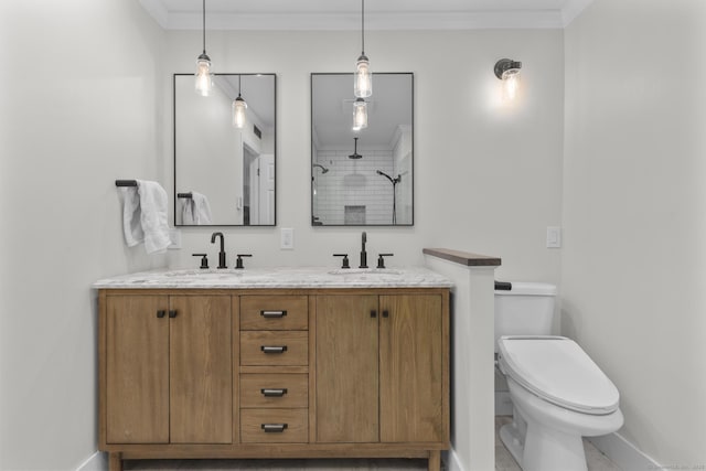 2 Mansfield Grove Rd Apt 166, East Haven, CT 06512 - bathroom with baseboards, double vanity, toilet, a tile shower, and ornamental molding