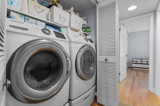 2 Mansfield Grove Rd Apt 166, East Haven, CT 06512 - washroom with washing machine and dryer, light wood finished floors, and baseboards