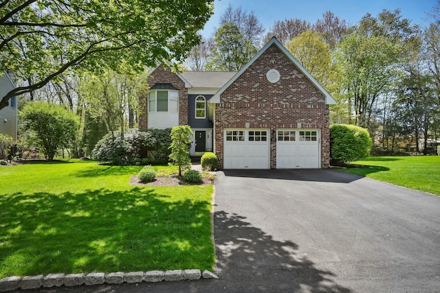 10 Wilton Hunt Rd, Wilton, CT 06897 - traditional home featuring asphalt driveway, a front lawn, brick siding, and an attached garage