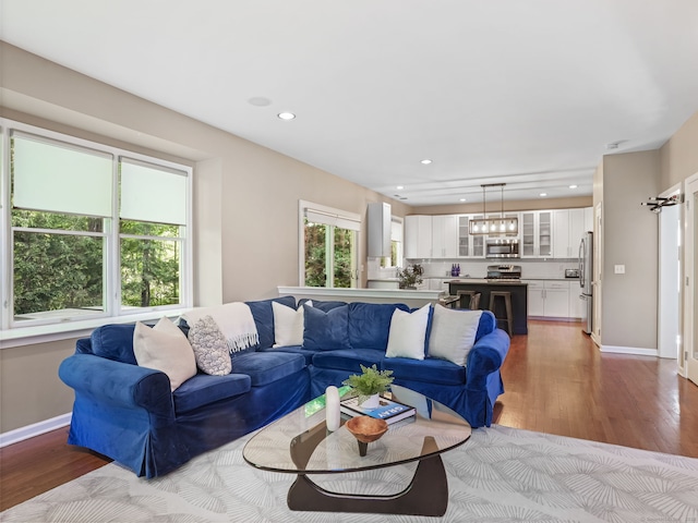 10 Wilton Hunt Rd, Wilton, CT 06897 - living room featuring wood finished floors, baseboards, recessed lighting, and a chandelier