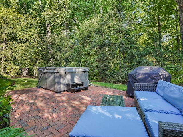 10 Wilton Hunt Rd, Wilton, CT 06897 - view of patio with a hot tub, outdoor lounge area, and a wooded view
