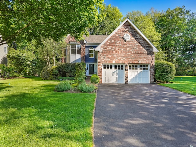 10 Wilton Hunt Rd, Wilton, CT 06897 - view of front facade featuring driveway, a front lawn, brick siding, and a garage