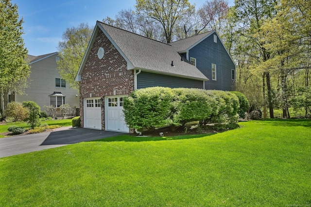 10 Wilton Hunt Rd, Wilton, CT 06897 - view of side of home featuring asphalt driveway, roof with shingles, a garage, a yard, and brick siding