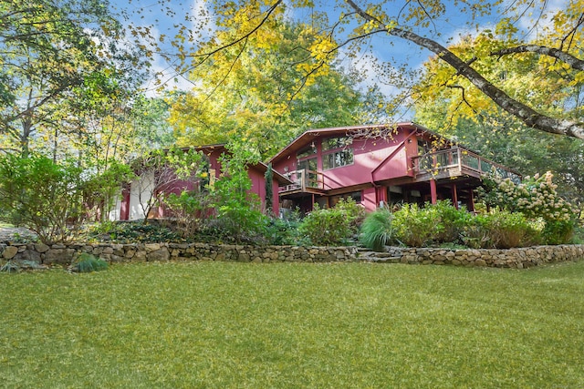 235 Whipstick Rd, Wilton, CT 06897 - rear view of property featuring a wooden deck and a lawn