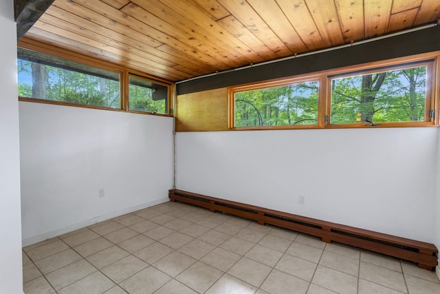 235 Whipstick Rd, Wilton, CT 06897 - spare room featuring a baseboard heating unit, wooden ceiling, and light tile patterned floors
