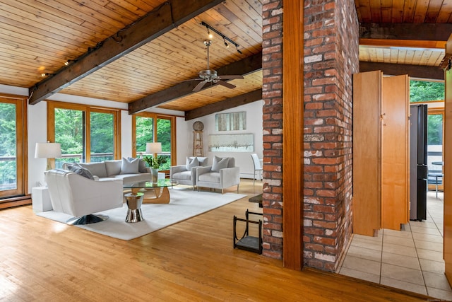 235 Whipstick Rd, Wilton, CT 06897 - living room featuring a wood ceiling with exposed beams, rail lighting, wood finished floors, and a ceiling fan