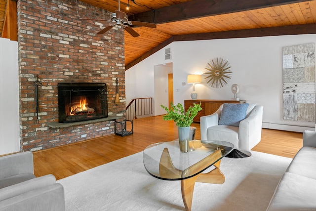 235 Whipstick Rd, Wilton, CT 06897 - living room featuring wood ceiling, wood finished floors, a baseboard radiator, a ceiling fan, and a fireplace