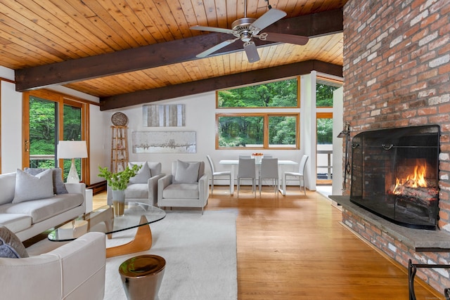 235 Whipstick Rd, Wilton, CT 06897 - living room featuring plenty of natural light, a wooden ceiling with exposed beams, wood finished floors, a ceiling fan, and a fireplace