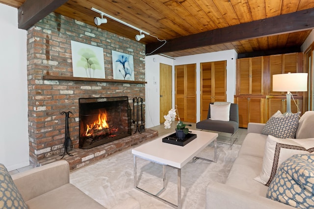 235 Whipstick Rd, Wilton, CT 06897 - living room with a wooden ceiling with exposed beams, a fireplace, and rail lighting