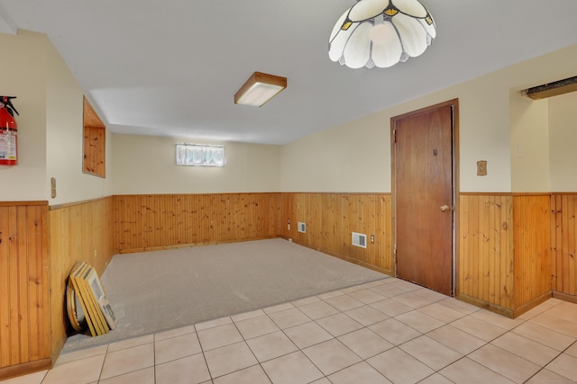 31 Hemlock Dr, Southington, CT 06489 - spare room featuring a wainscoted wall, wooden walls, and carpet flooring