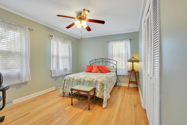 31 Hemlock Dr, Southington, CT 06489 - bedroom featuring light wood-type flooring, multiple windows, a closet, crown molding, and baseboards