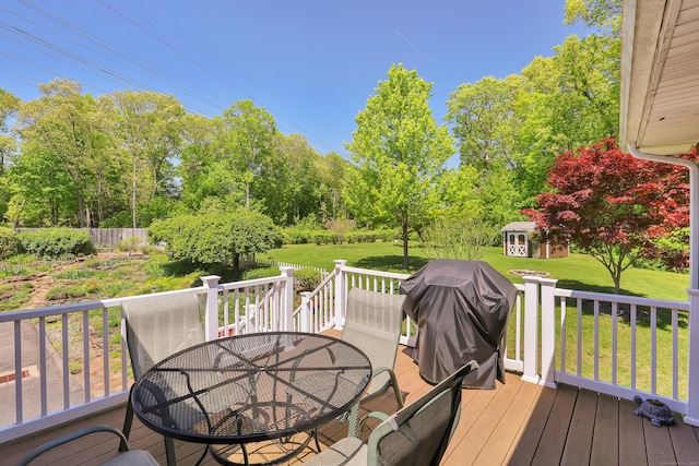 31 Hemlock Dr, Southington, CT 06489 - wooden deck with outdoor dining space, an outbuilding, a lawn, area for grilling, and view of scattered trees