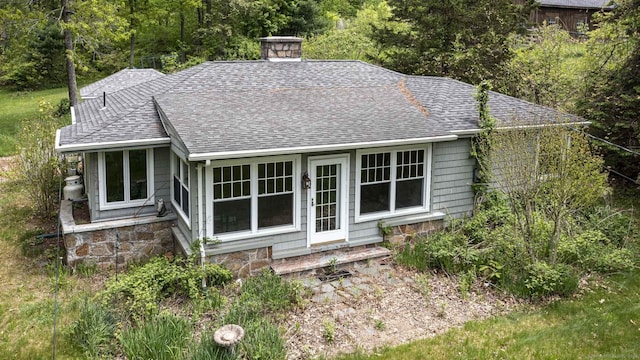 179 Parker Rd, Somers, CT 06071 - rear view of house featuring a shingled roof and a chimney