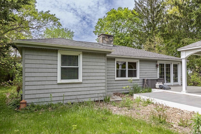 179 Parker Rd, Somers, CT 06071 - rear view of property with a wooden deck, a chimney, and roof with shingles