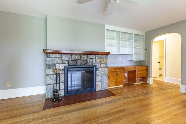 179 Parker Rd, Somers, CT 06071 - unfurnished living room with wood finished floors, baseboards, arched walkways, and a ceiling fan