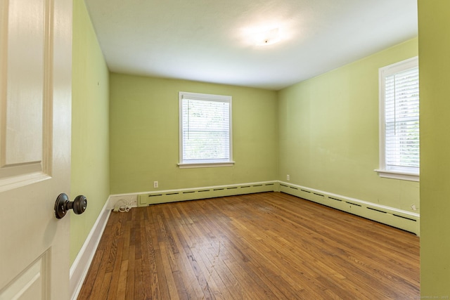 179 Parker Rd, Somers, CT 06071 - spare room featuring hardwood / wood-style floors, healthy amount of natural light, baseboard heating, and baseboards
