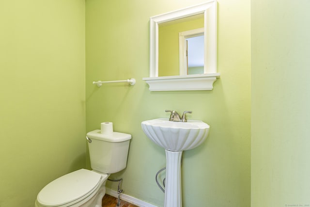 179 Parker Rd, Somers, CT 06071 - bathroom featuring toilet, wood finished floors, baseboards, and a sink