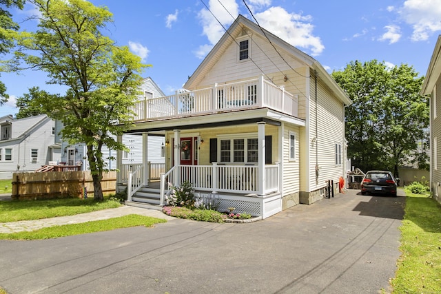 28 Edmund St, Stratford, CT 06614 - view of front of house featuring a porch, a balcony, and driveway