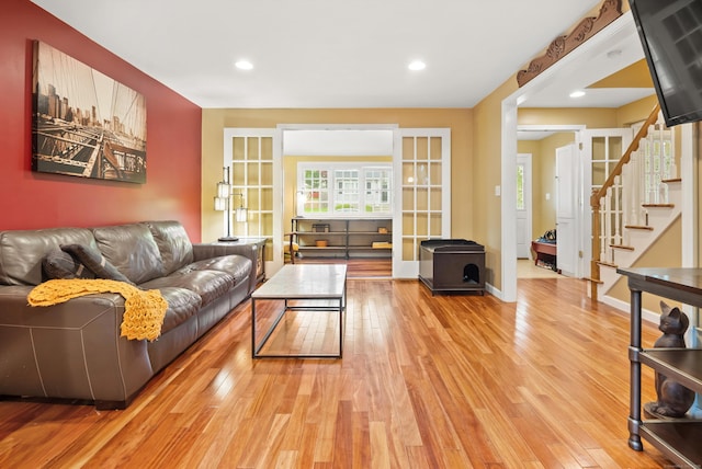 28 Edmund St, Stratford, CT 06614 - living area with light wood-style flooring, plenty of natural light, stairs, and recessed lighting