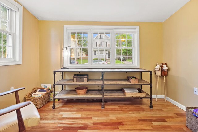 28 Edmund St, Stratford, CT 06614 - sitting room with plenty of natural light, wood finished floors, and baseboards