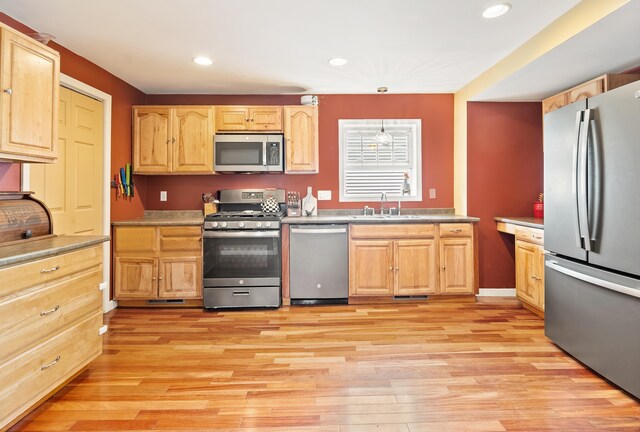 28 Edmund St, Stratford, CT 06614 - kitchen featuring stainless steel appliances, light wood-type flooring, light brown cabinets, and recessed lighting