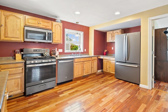 28 Edmund St, Stratford, CT 06614 - kitchen with appliances with stainless steel finishes, light wood-style flooring, light brown cabinets, recessed lighting, and light countertops