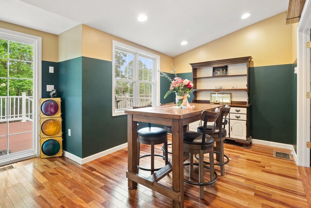 28 Edmund St, Stratford, CT 06614 - dining space with light wood finished floors, healthy amount of natural light, baseboards, vaulted ceiling, and recessed lighting