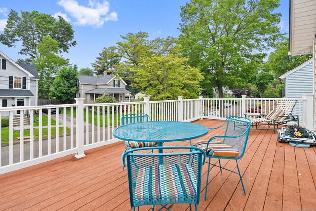 28 Edmund St, Stratford, CT 06614 - wooden terrace with outdoor dining area