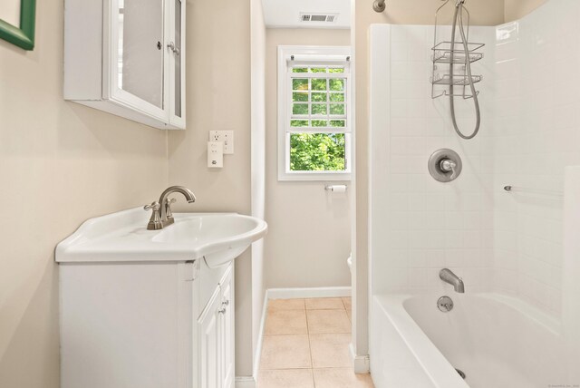 28 Edmund St, Stratford, CT 06614 - full bathroom featuring tile patterned flooring, baseboards, vanity, and tub / shower combination
