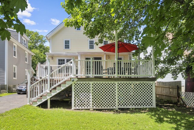 28 Edmund St, Stratford, CT 06614 - back of property with stairs and a wooden deck