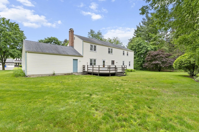 8 Michael Rd, Simsbury, CT 06070 - rear view of house featuring a deck, a yard, and a chimney