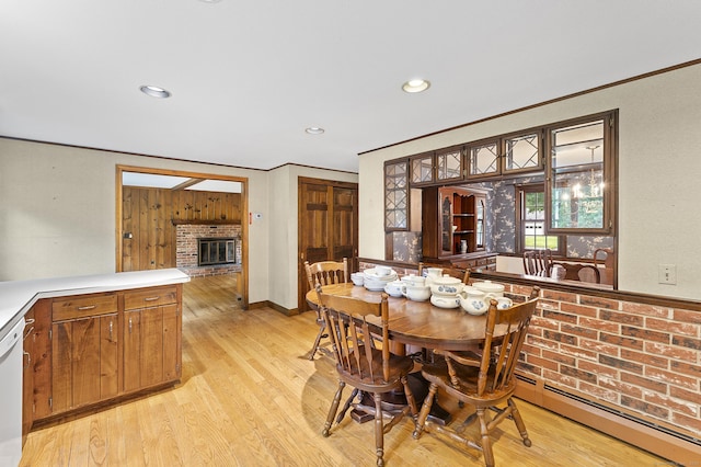 8 Michael Rd, Simsbury, CT 06070 - dining room featuring baseboard heating, light wood-style floors, crown molding, a fireplace, and recessed lighting