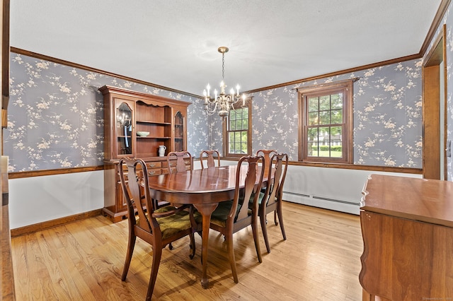 8 Michael Rd, Simsbury, CT 06070 - dining area with a baseboard radiator, crown molding, a chandelier, light wood-style floors, and wallpapered walls