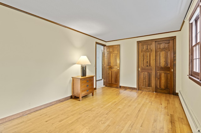 8 Michael Rd, Simsbury, CT 06070 - unfurnished bedroom featuring a baseboard heating unit, ornamental molding, light wood-type flooring, and baseboards