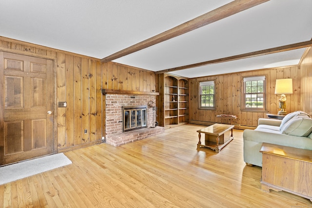 8 Michael Rd, Simsbury, CT 06070 - living area featuring beam ceiling, wooden walls, wood finished floors, and a brick fireplace