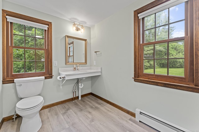 8 Michael Rd, Simsbury, CT 06070 - bathroom with baseboard heating, plenty of natural light, baseboards, and toilet