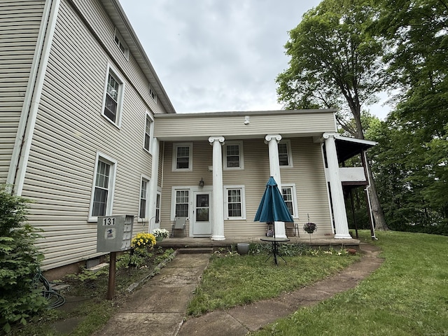 131 W Main St, Southington, CT 06479 - rear view of house with a yard