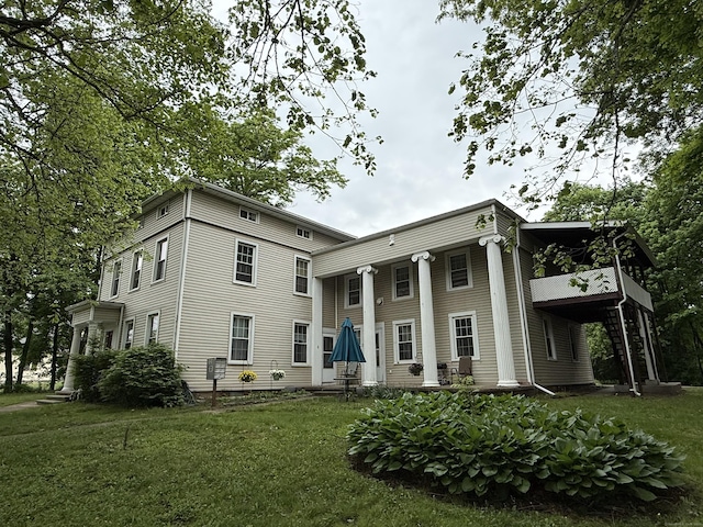 131 W Main St, Southington, CT 06479 - rear view of property featuring a lawn