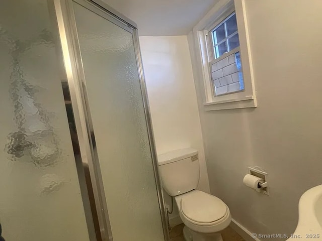 131 W Main St, Southington, CT 06479 - full bathroom featuring toilet, baseboards, and a shower stall