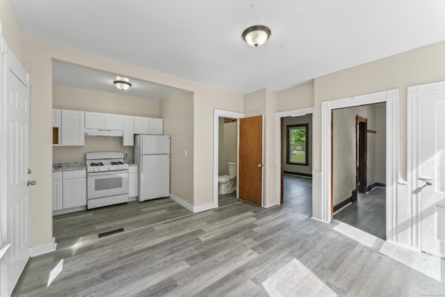 38 Ford St, New Haven, CT 06511 - kitchen featuring white appliances, under cabinet range hood, light wood-type flooring, white cabinetry, and baseboards
