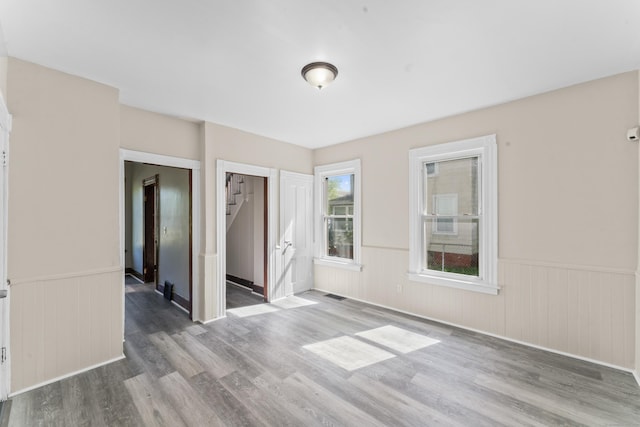38 Ford St, New Haven, CT 06511 - unfurnished room with wood finished floors and a wainscoted wall