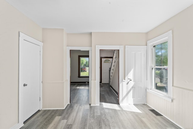 38 Ford St, New Haven, CT 06511 - unfurnished bedroom featuring wainscoting and wood finished floors
