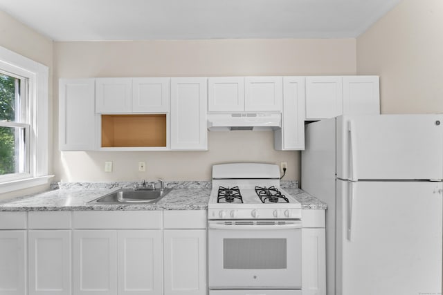 38 Ford St, New Haven, CT 06511 - kitchen featuring white appliances, under cabinet range hood, a sink, and white cabinets