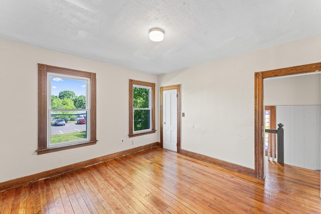 38 Ford St, New Haven, CT 06511 - empty room featuring light wood-style floors, baseboards, and a textured ceiling